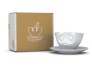 Kaffeetasse k�ssend, neben Karton Kaffeetasse k�ssend, neben Karton